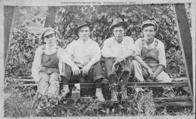 006 Young Men Sitting on Tracks
